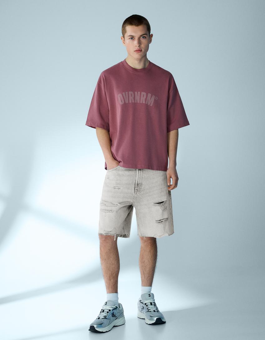 Bermuda en denim déchiré
