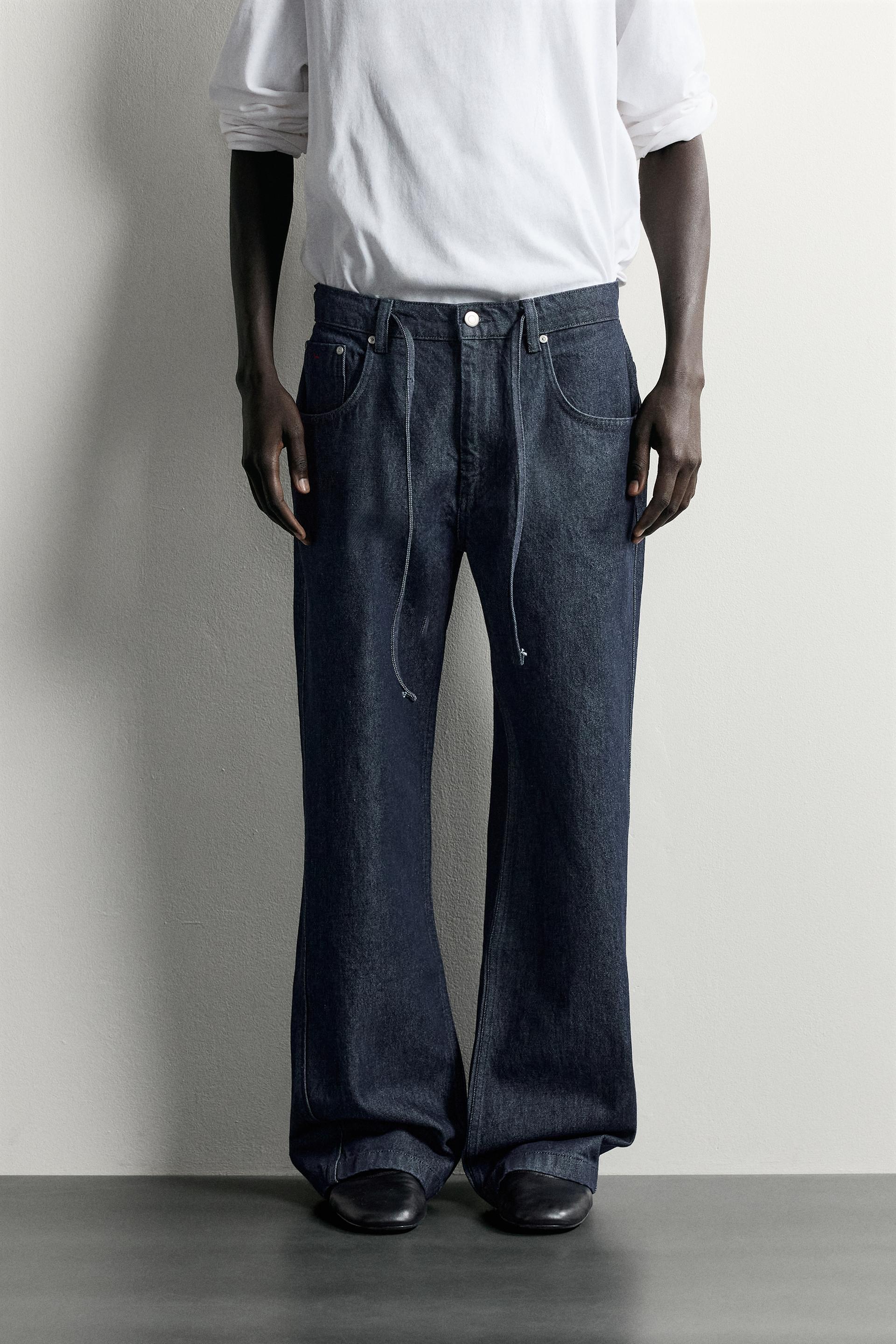 JEANS RELAXED FIT COSTURA GIRADA