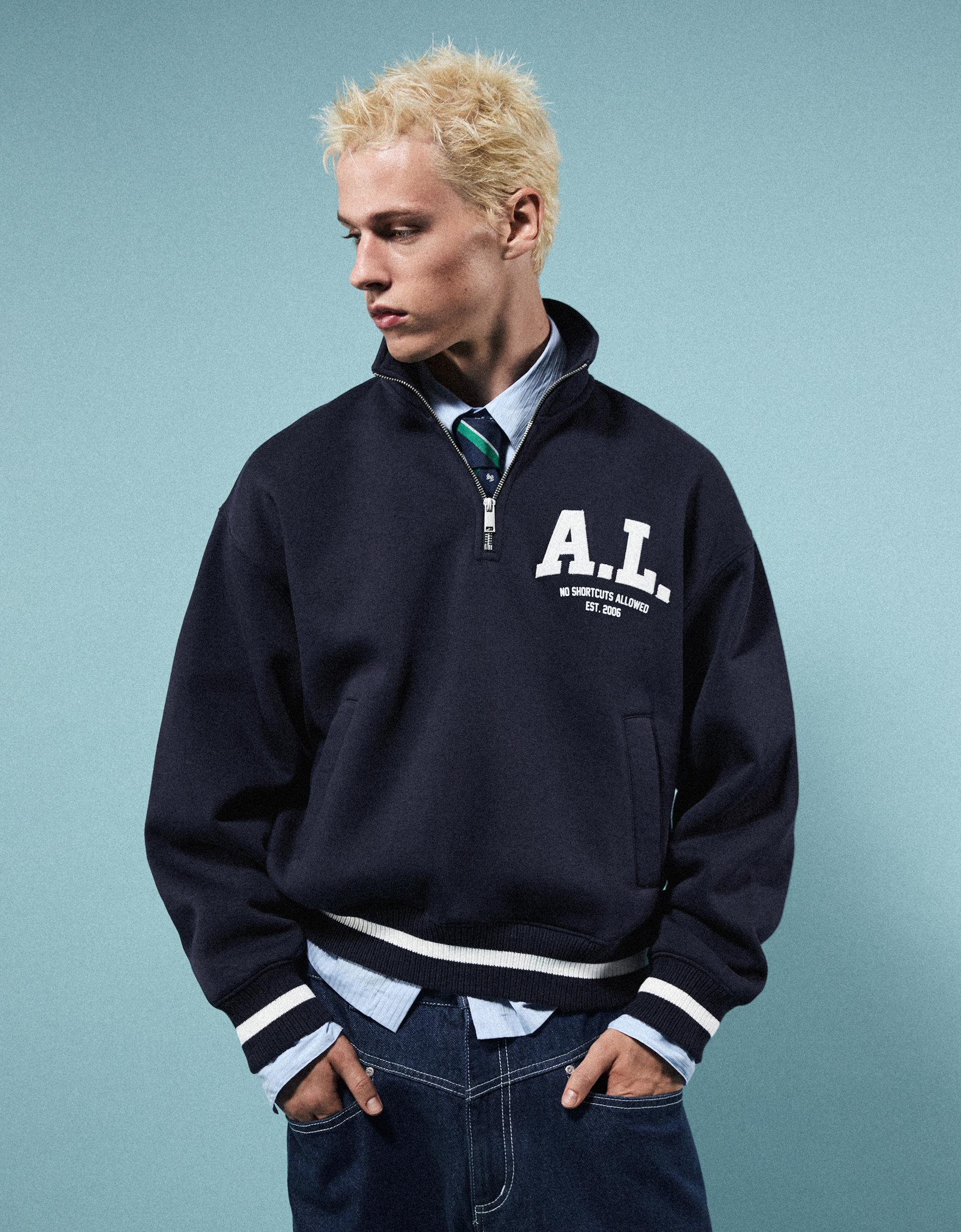 Sweat demi-zip écusson